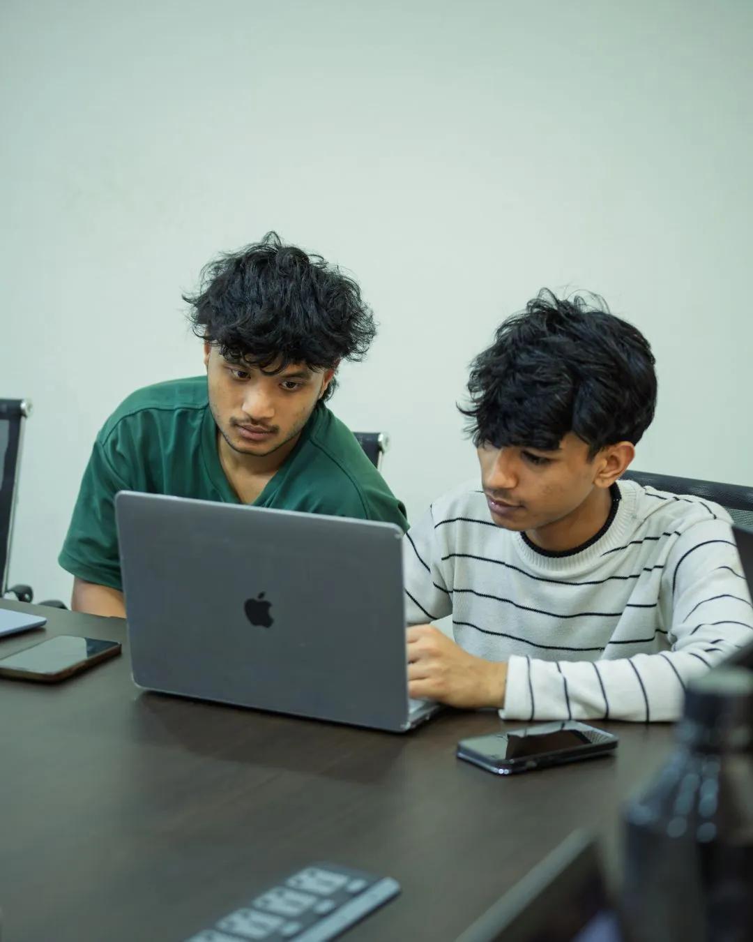 Two students working together in class