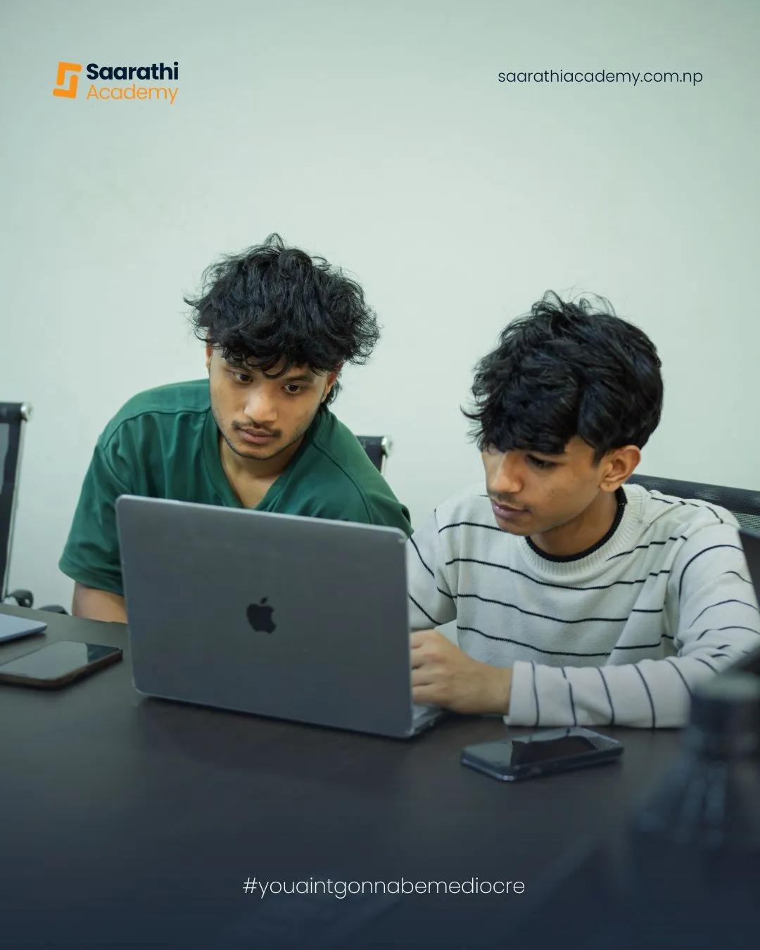 Two students working together in class