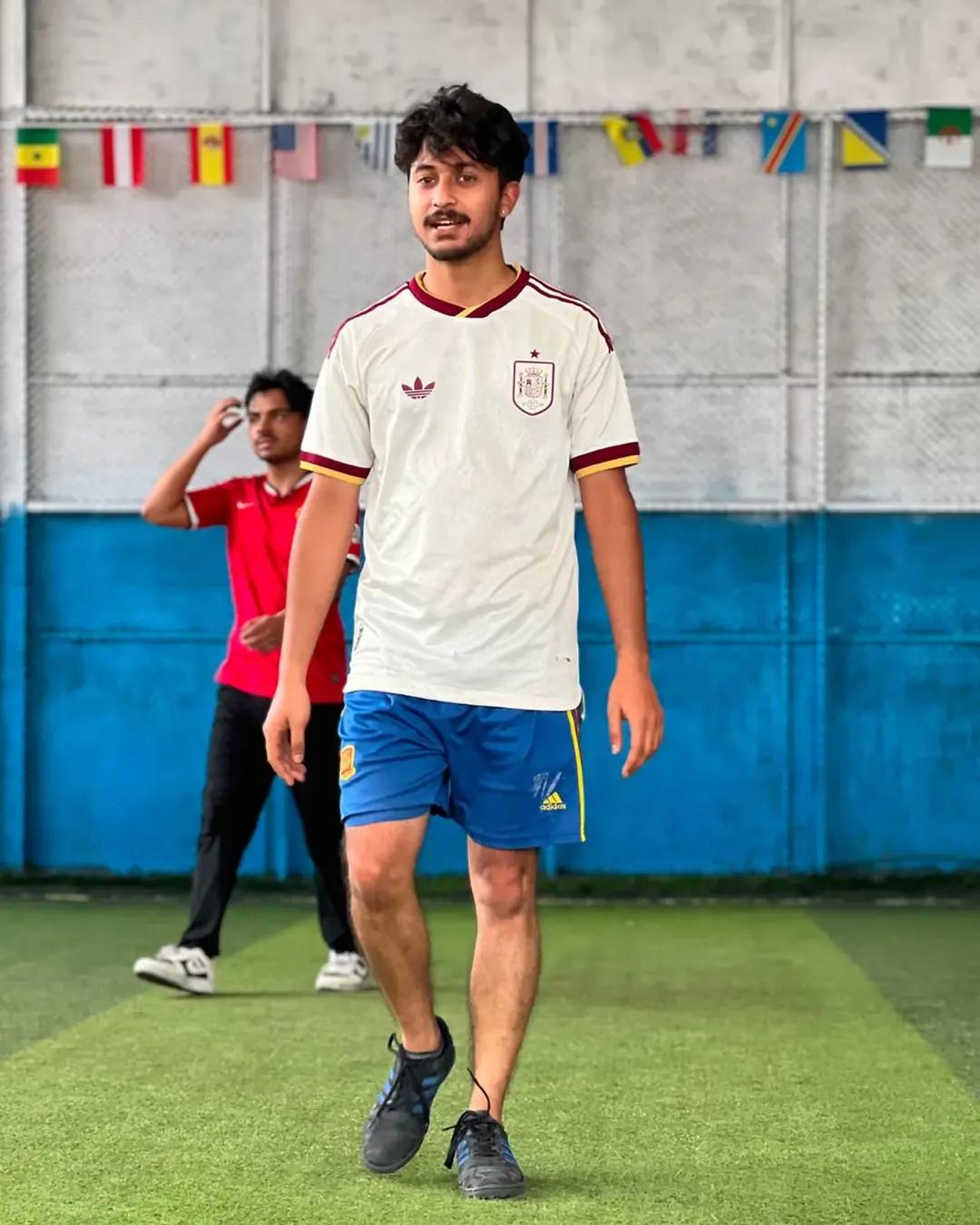 A student walking onto the futsal court
