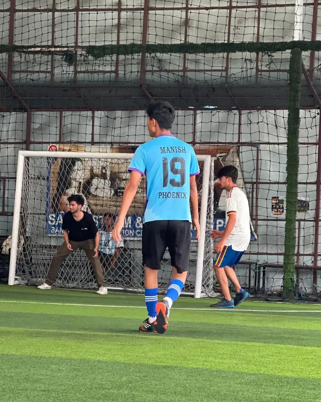 Students mid-game at the futsal court