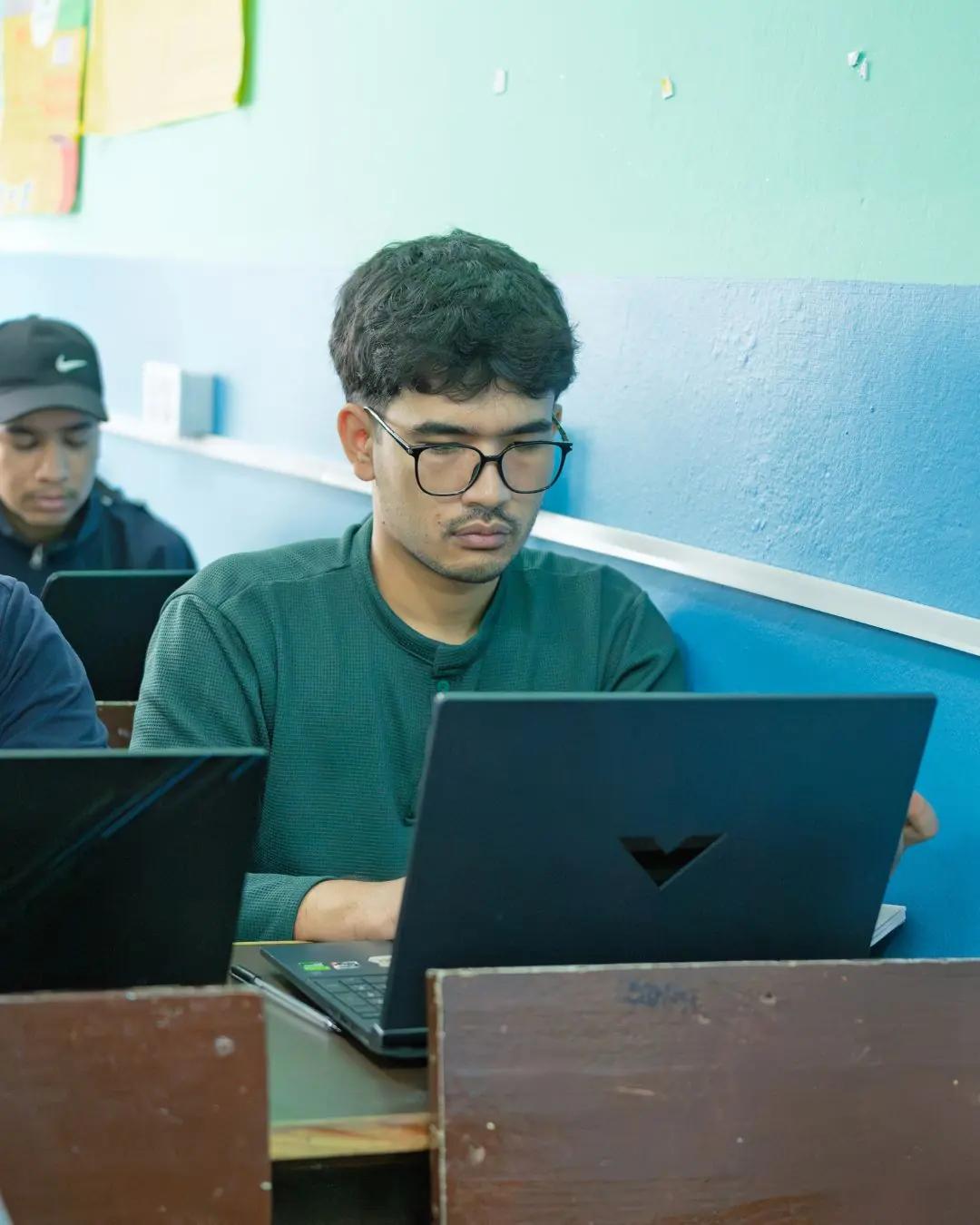 A student mid-exercise on his laptop