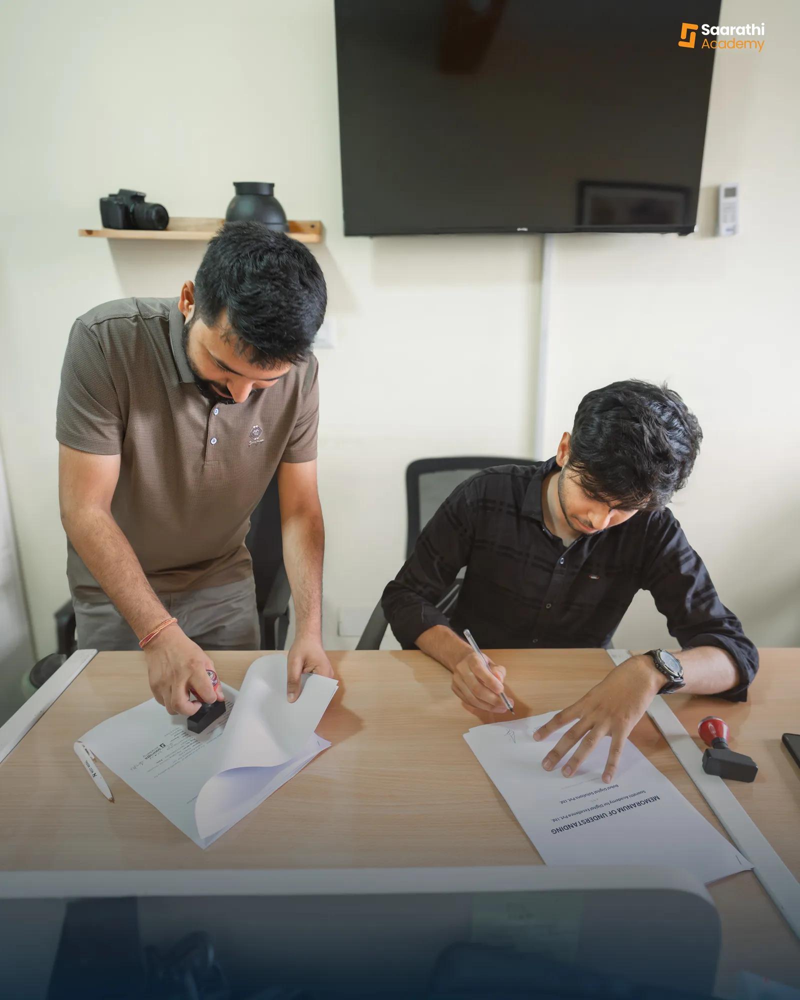 Stamping the MoU with Babal Host